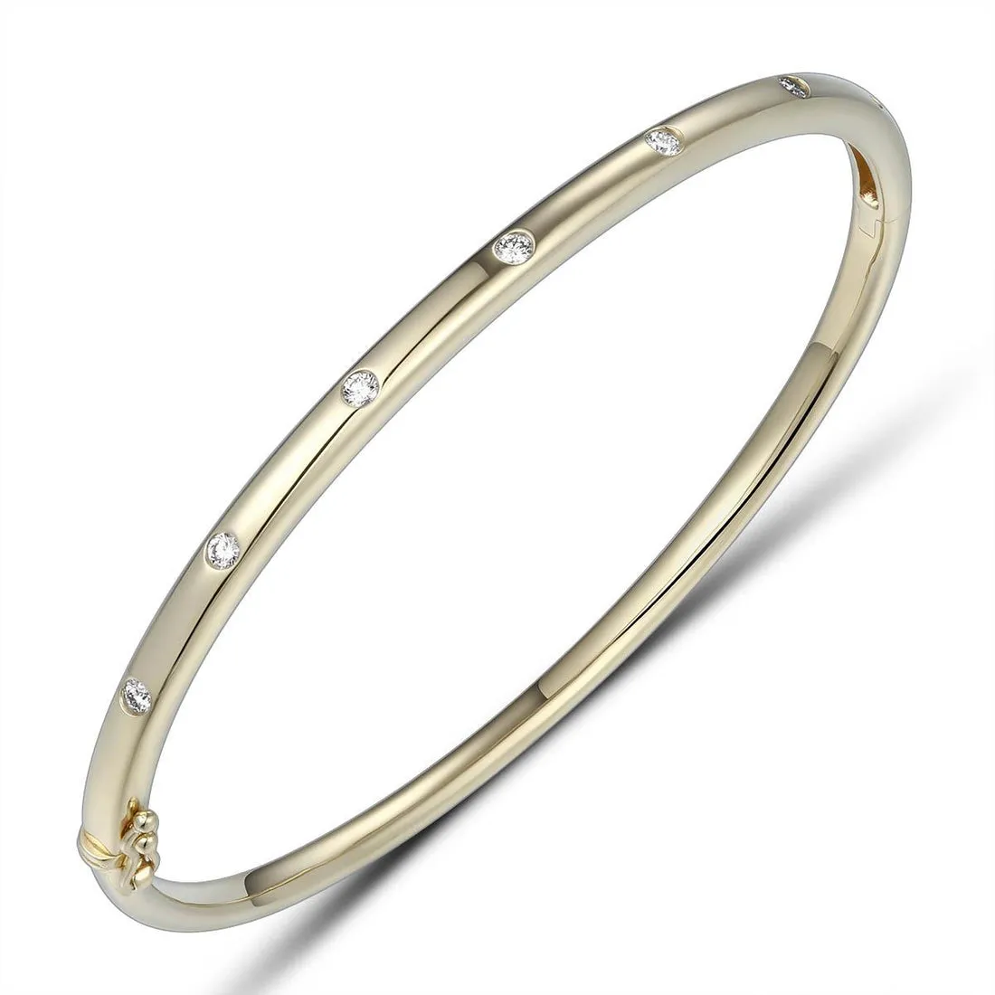 18ct Gold yellow gold 7 inset spaced out across the top diamond set bangle