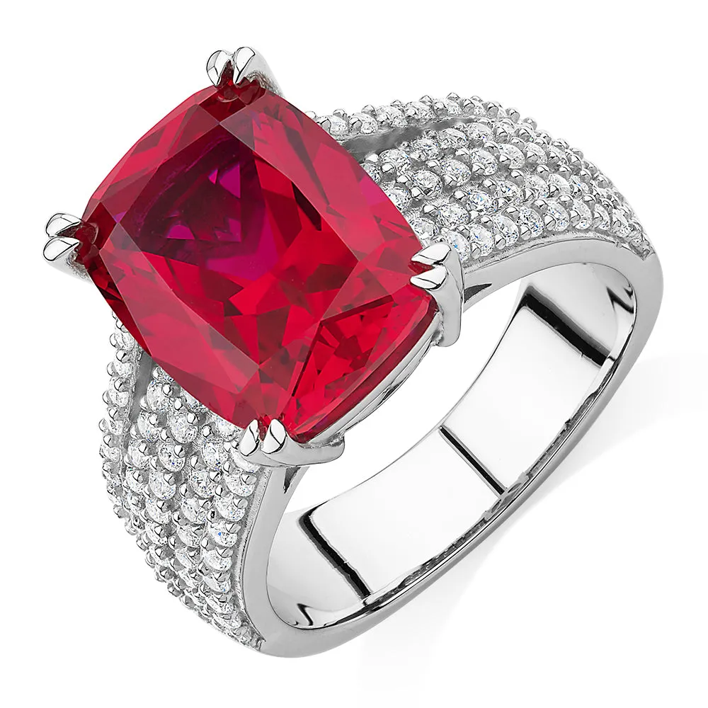 Dress ring with ruby simulant and 0.90 carats* of diamond simulants in sterling silver