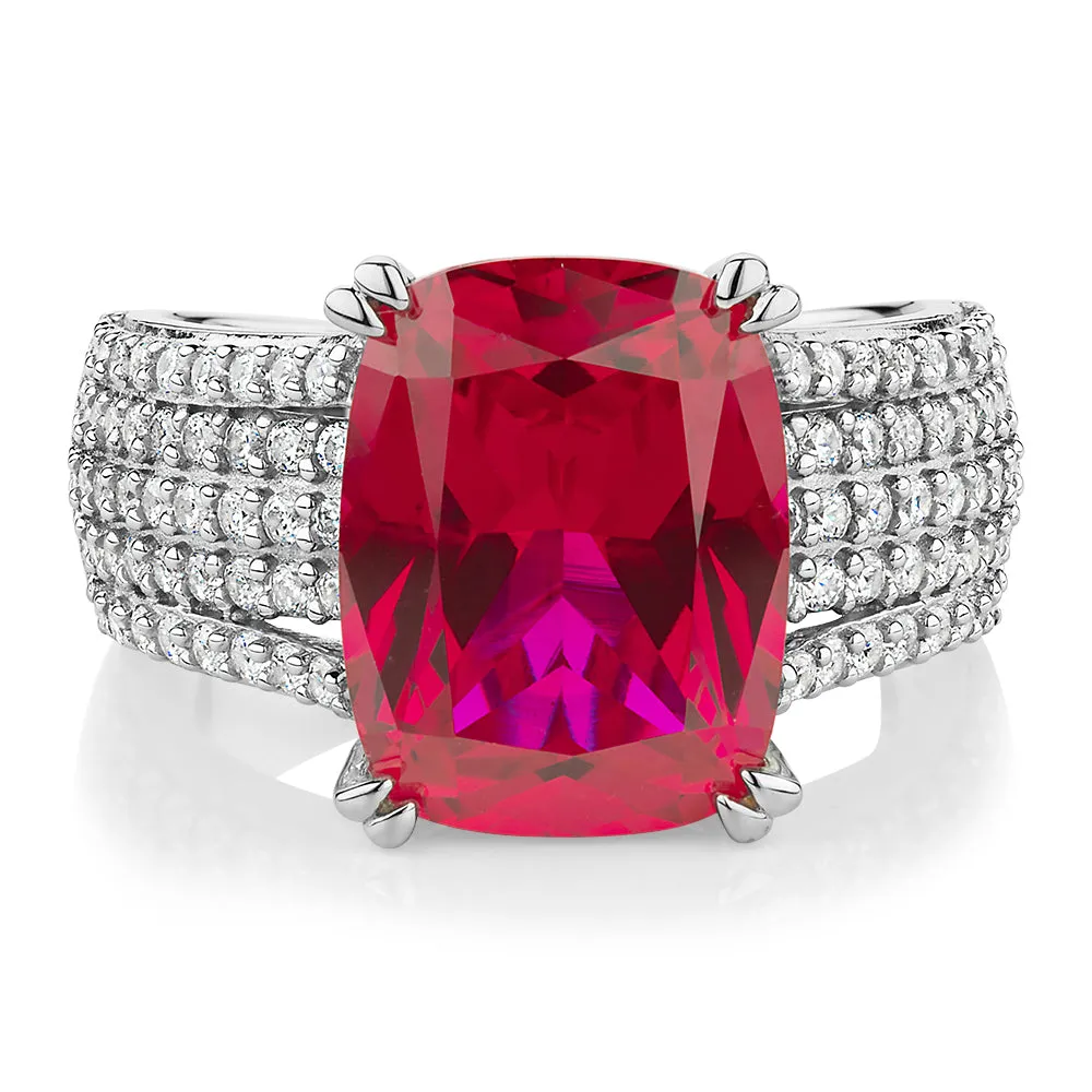 Dress ring with ruby simulant and 0.90 carats* of diamond simulants in sterling silver